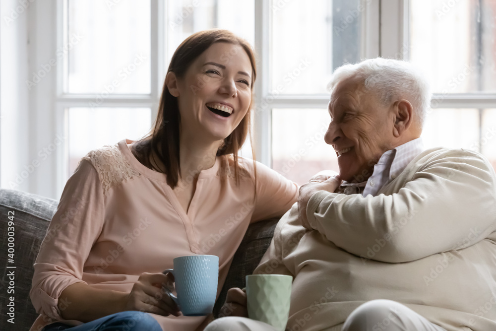 Ταπετσαρία Family members of two generations grown daughter and mature father having fun enjoy tea talk on cozy couch