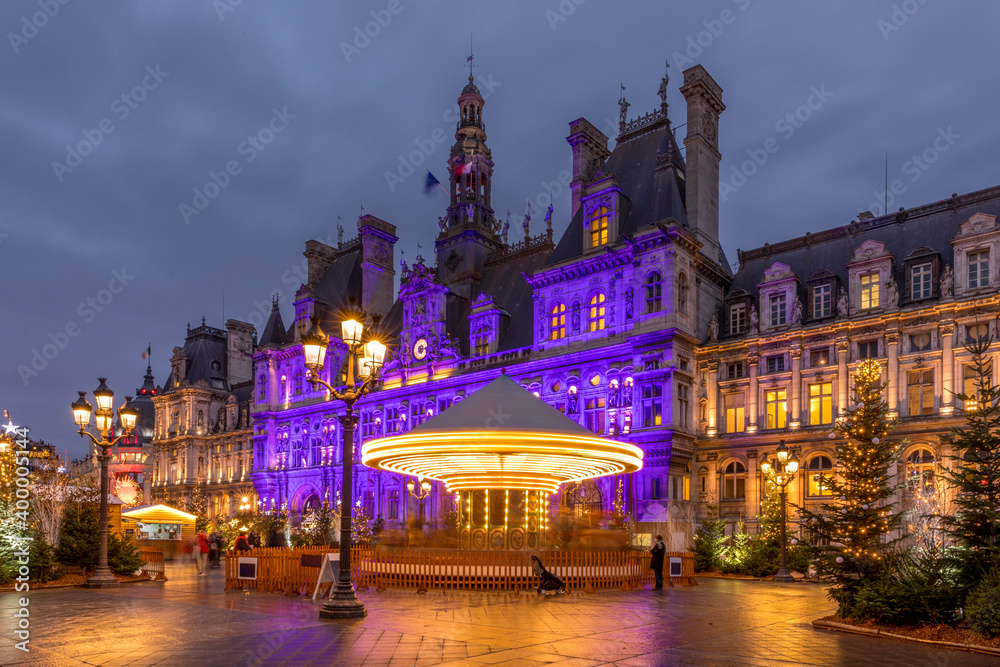 Paris, France - December 14, 2020: Parisian City Hall (Hotel de Ville) decorated for Christmas at night