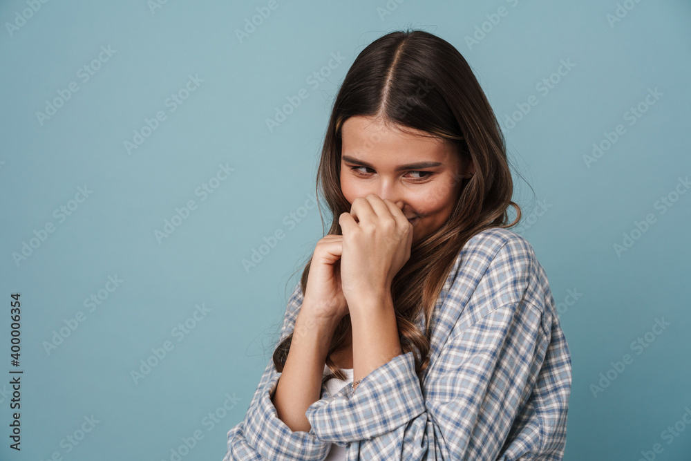 Happy beautiful modest girl smiling and looking downward Happy beautiful modest girl smiling and looking downward