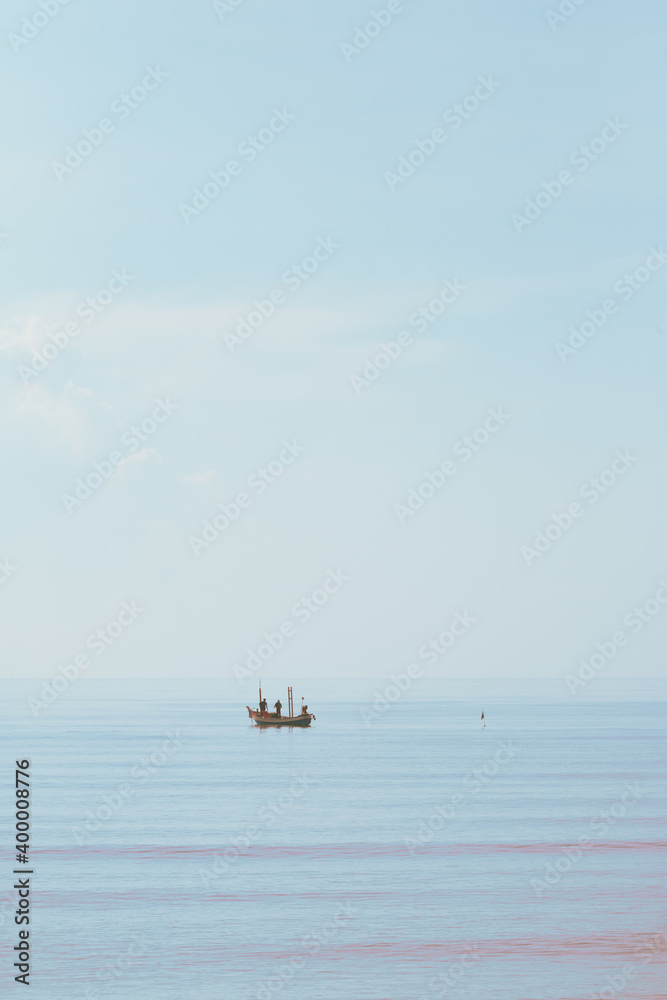 Fisherman boats on the sea. Clean background. Vintage hight key style for copy space.