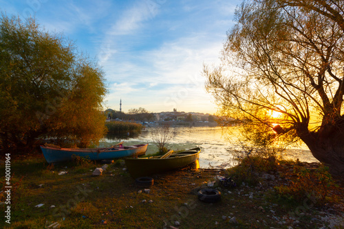 Beautiful sunset landscape at Gölyazı (Golyazi) on Lake Ulubat. with golden sun and tree, Bursa, Turkey. photo