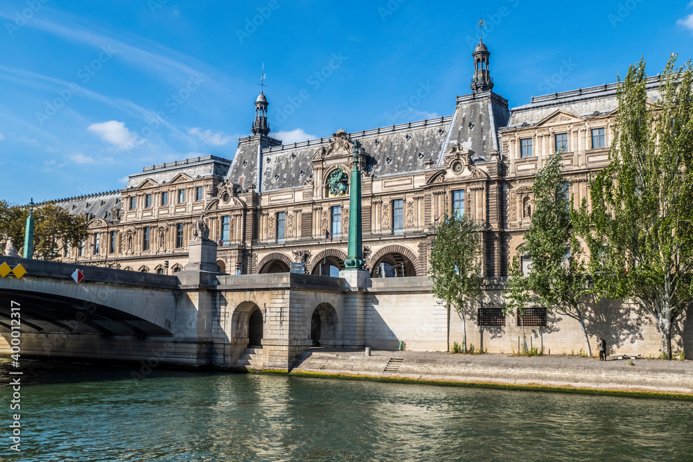  The facade of the Louvre Museum and the Seine River