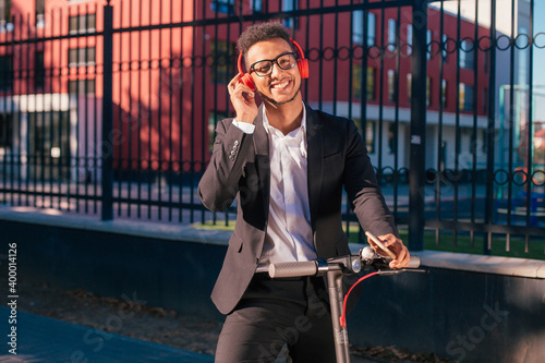 Close up of african american man on electric scooter listening music