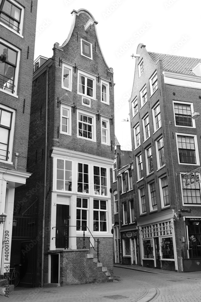 Street View with Old Houses in Amsterdam Red Light District in Black and White