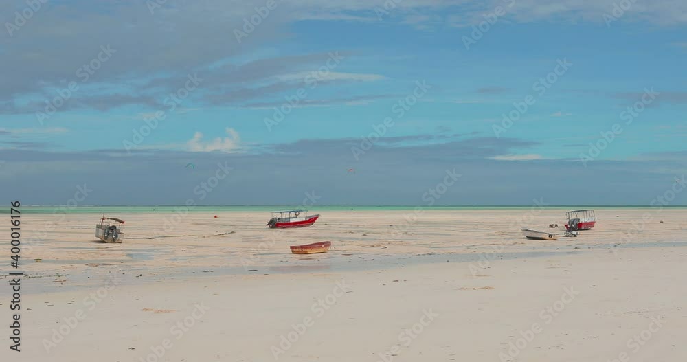Beautiful frame of boats at low tide. Fishing boats lie on the sand when the Indian Ocean has receded and there is no water. Landscape video with textured sky.
Beautiful frame of boats at low tide. Fishing boats lie on the sand when the Indian Ocean has receded and there is no water. Landscape video with textured sky.