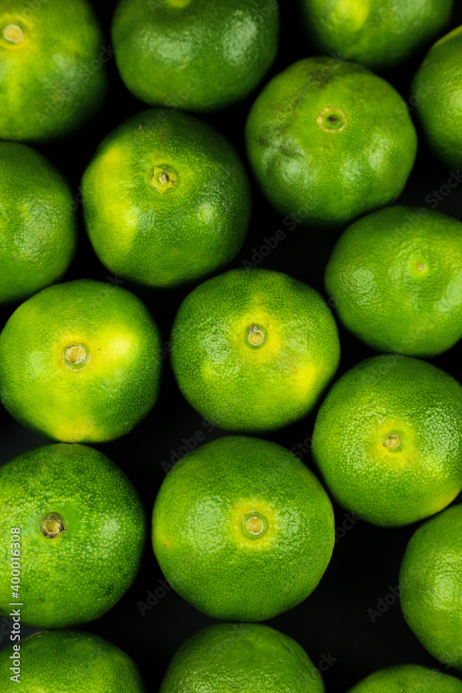 Green sweet tangerines growing with background