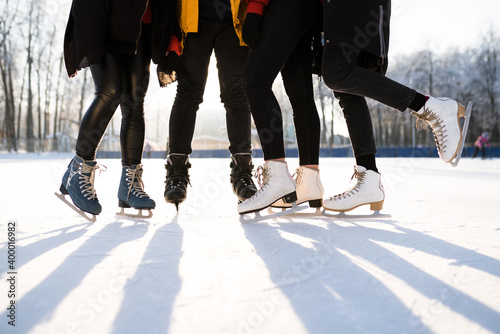 The concept of outdoor activities using skates on snowy ice. Outdoor vacations