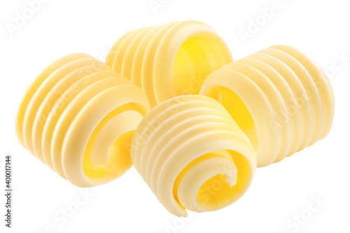 Butter curls rolled up, a group of four,  isolated