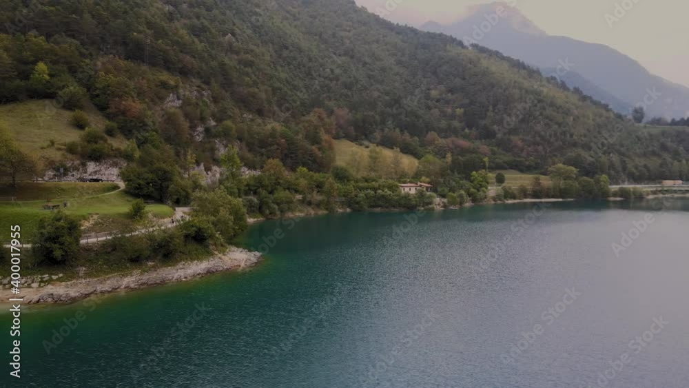 Picturesque coastline of Lake Ledro in Northern Italy at dawn, aerial view Picturesque coastline of Lake Ledro in Northern Italy at dawn, aerial view