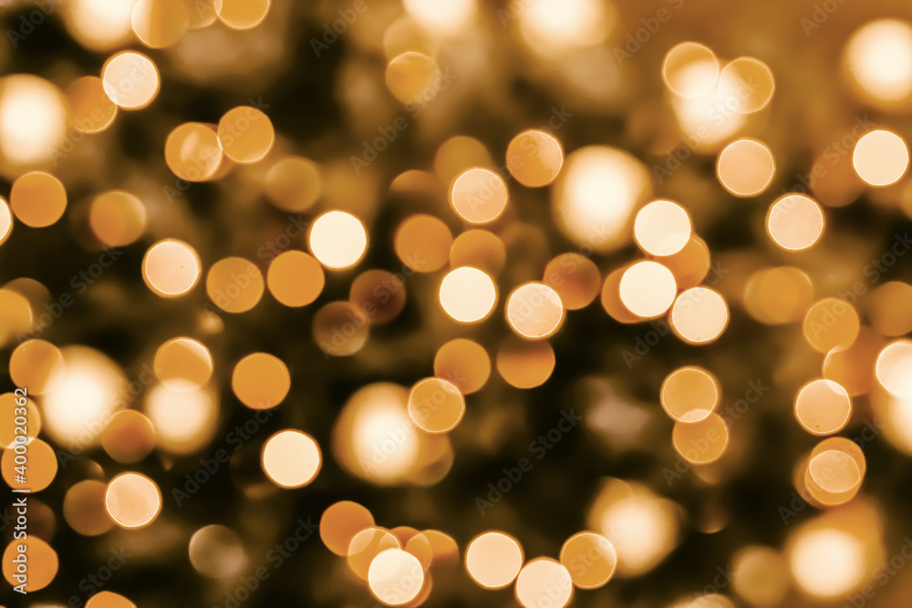Festive background golden orange yellow bokeh on black background. Christmas background Festive background golden orange yellow bokeh on black background. Christmas background