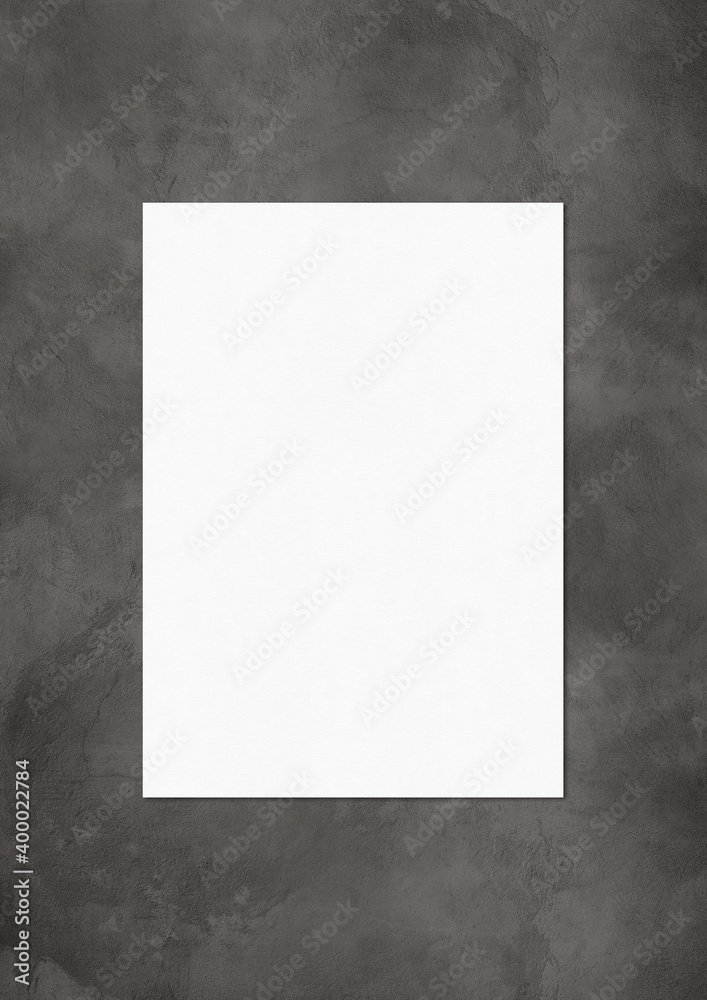 Blank White A4 paper sheet mockup template on dark concrete background Blank White A4 paper sheet mockup template on dark concrete background