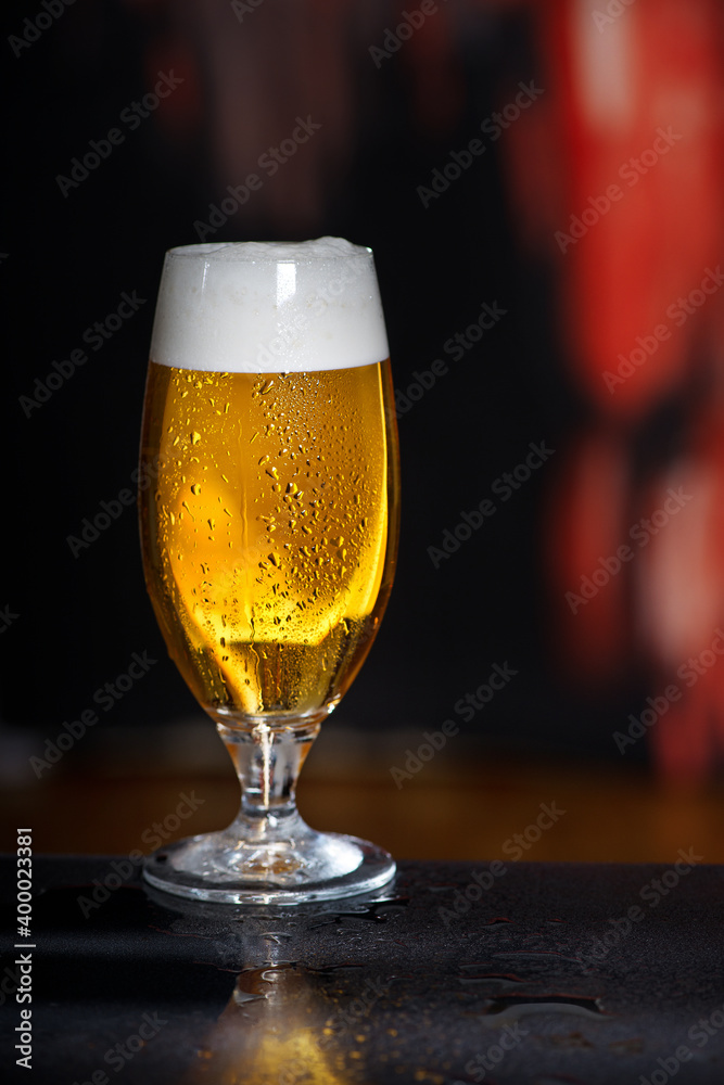 Glass of beer on the dark background Glass of beer on the dark background