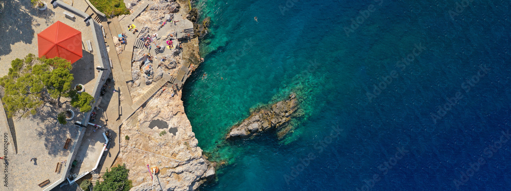 Aerial drone ultra wide photo of small picturesque port of Hydra island, Saronic gulf, Attica, Greece