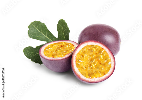 Delicious passion fruits (maracuya) and green leaf on white background