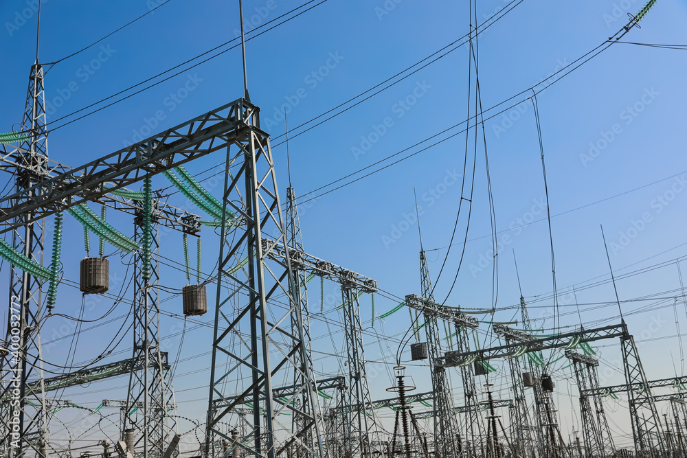 Modern electrical substation on sunny day, low angle view Modern electrical substation on sunny day, low angle view