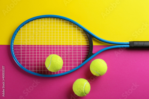 Tennis racket and balls on color background, flat lay. Sports equipment © New Africa