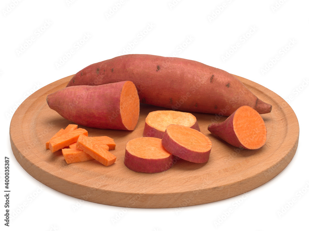 Sweet potato on a wooden board isolated on white background Sweet potato on a wooden board isolated on white background