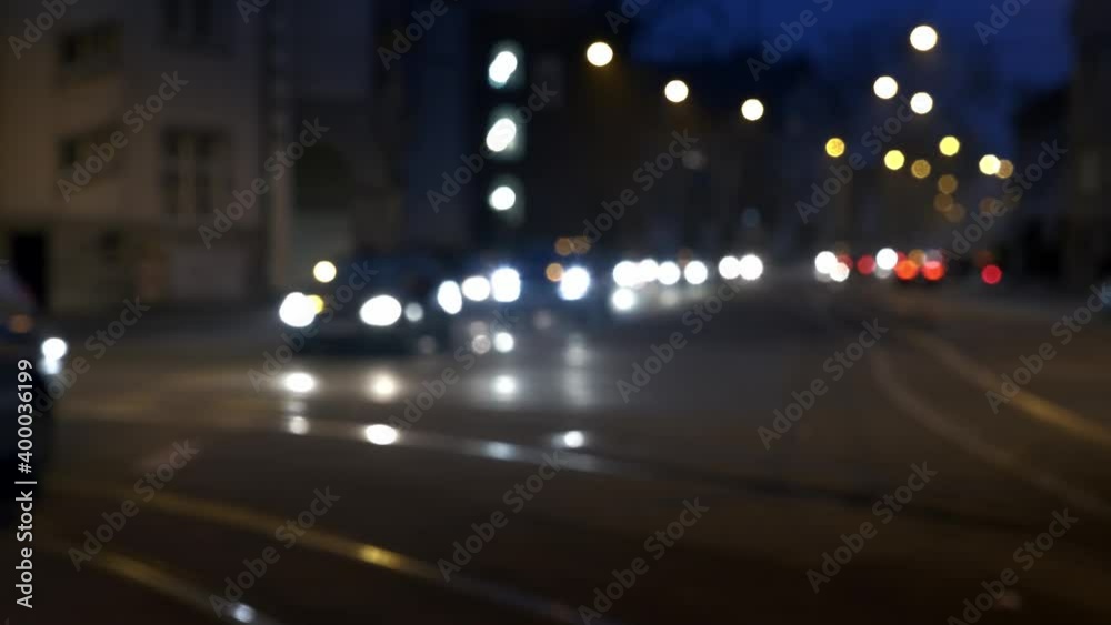 A busy street at night where the lights and the cars are blurred and serves as a background A busy street at night where the lights and the cars are blurred and serves as a background