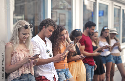 group of young people chat with smartphone