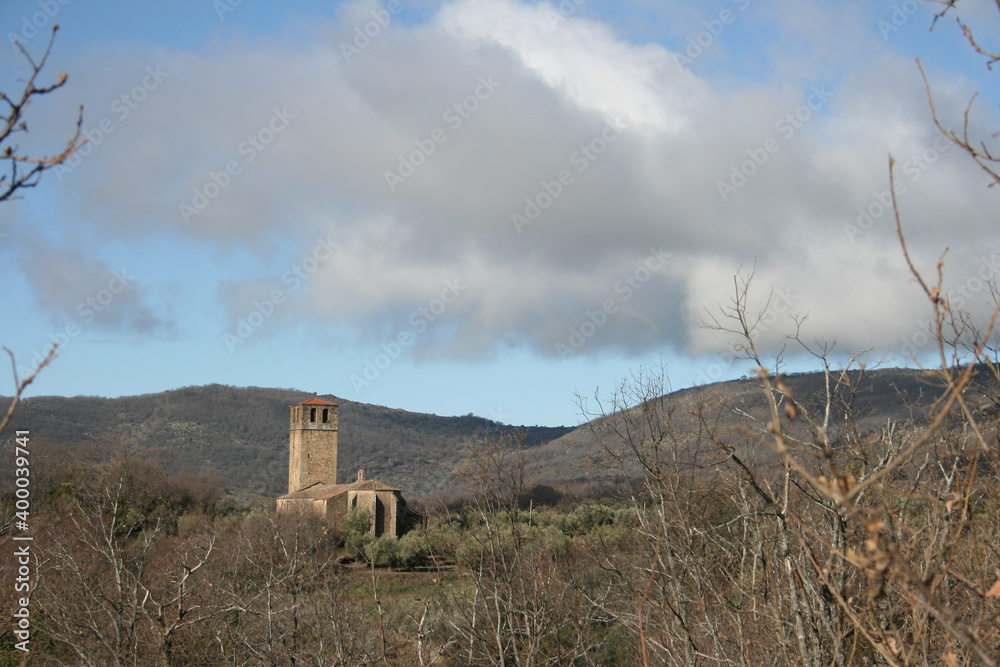 Church of the town of Garguera de la Vera in the middle of the oak forest.