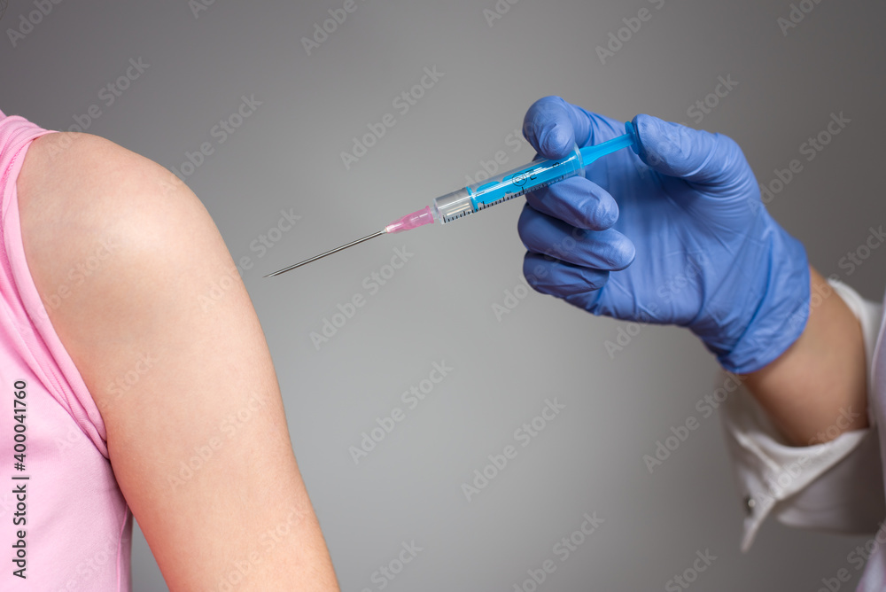 Doctor is preparing to vaccinate the patient Doctor is preparing to vaccinate the patient