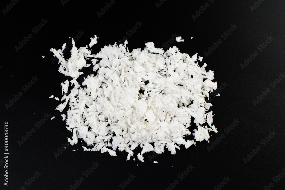 white artificial synthetic snow on black background white artificial synthetic snow on black background