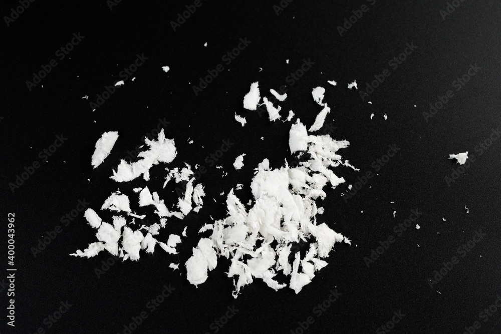 white artificial synthetic snow on black background white artificial synthetic snow on black background