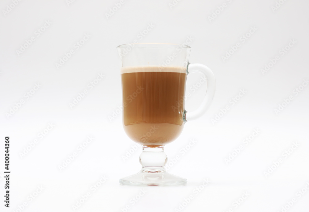 Hot coffee with milk in a transparent glass cup on a white background Hot coffee with milk in a transparent glass cup on a white background
