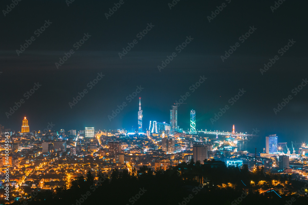 Batumi, Adjara, Georgia. Panorama, Aerial View Of Urban Cityscape At Sunset. Town At Evening Blue Hour time. City In Night Lights Illuminations