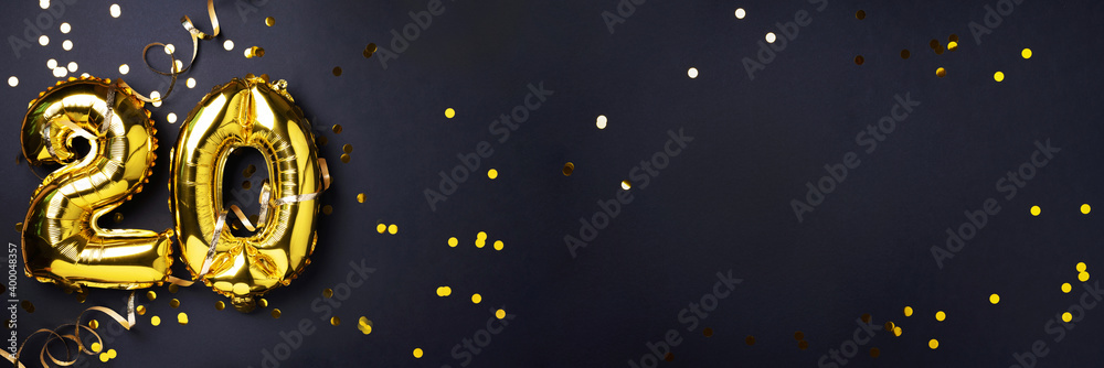 Gold foil balloon number, digit twenty. Birthday greeting card with inscription 20. Anniversary celebration event. Banner. Golden numeral, black background. Numerical digit, light bokeh, glitter. Gold foil balloon number, digit twenty. Birthday greeting card with inscription 20. Anniversary celebration event. Banner. Golden numeral, black background. Numerical digit, light bokeh, glitter.