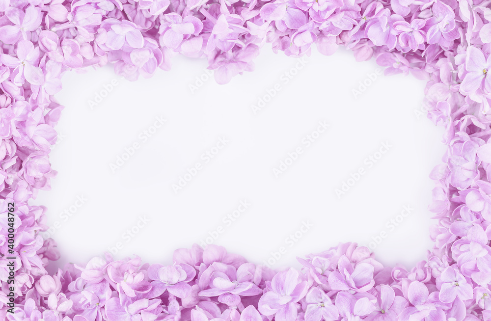 Lilac flowers frame closeup on tender violet background. Spring flowers for birthday Mothers or Women's Day greeting card. Copy space. Wedding border frame