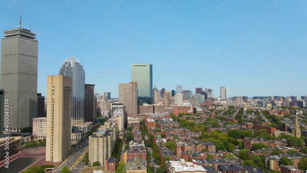 Boston Back Bay modern city skyline including John Hancock Tower, Prudential Tower, and Four Season Hotel at One Dalton Street in Boston, Massachusetts MA, USA.  