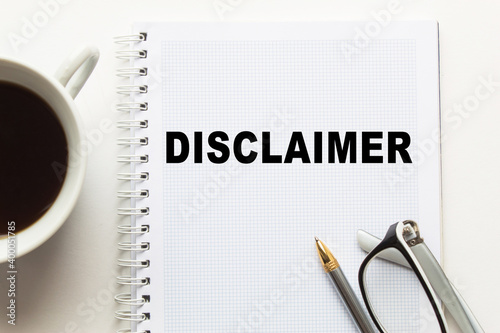 Notepad with inscriptions DISCLAIMER on a white background. business concept.