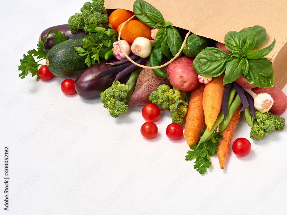 Vegetables in paper bag on white background. Vegetables in paper bag on white background.