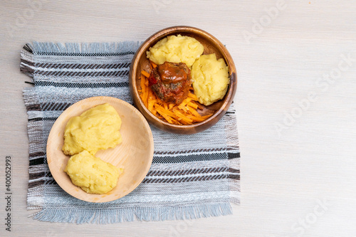 African maize porridge called ugly in bowl. nshima, with meat and sweet potatoes. copyspace photo