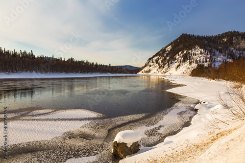 Winter landscape, the Katun river flows among the Altai mountains at sunset. Altai Republic, Russia