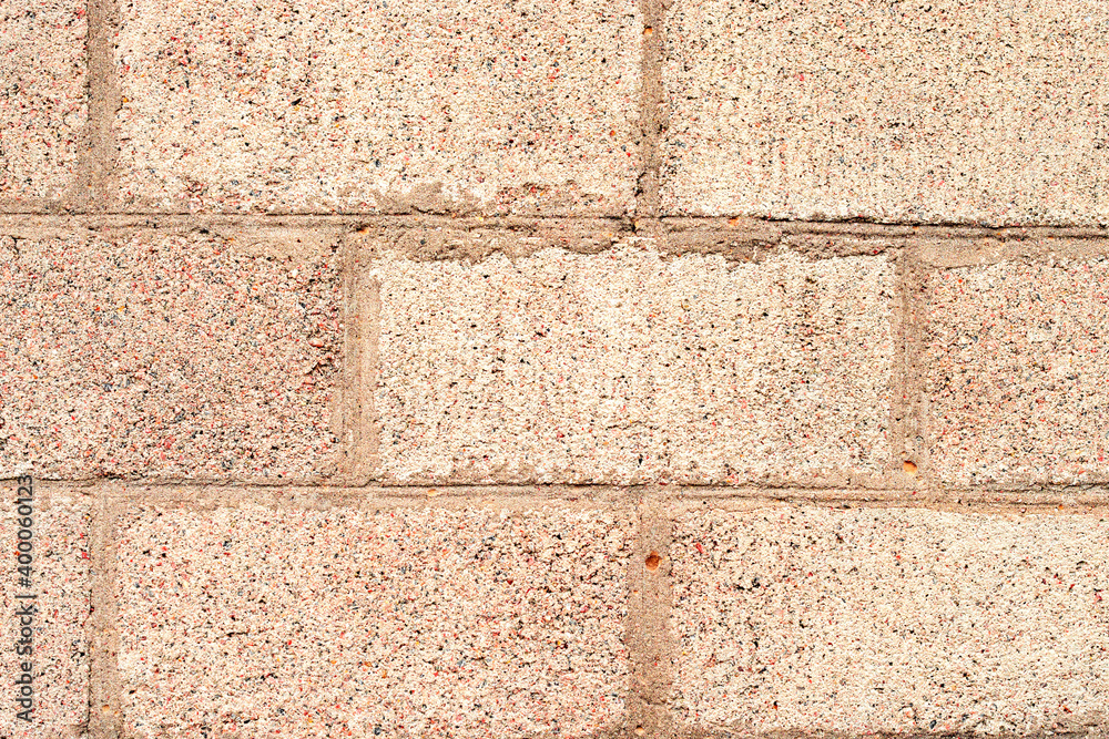 Obraz premium Texture of a brick wall with cracks and scratches which can be used as a background