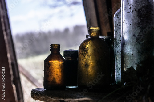 Empty brown old bottles in cabin