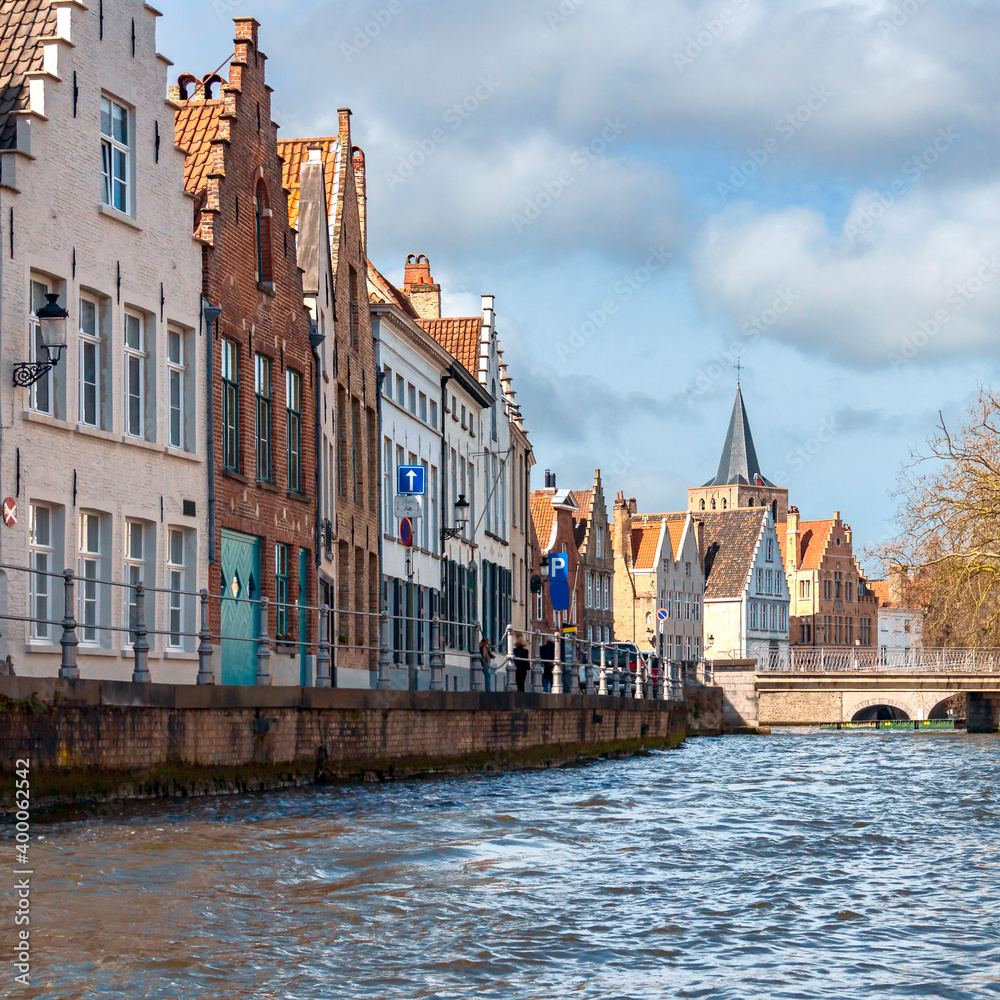 picturesque old houses along the banks of the river in the historical part of Bruges. Belgium