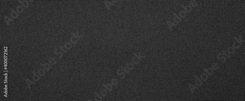Synthetic black nylon fabric.Texture of dense black fabric.The background is nylon black. photo