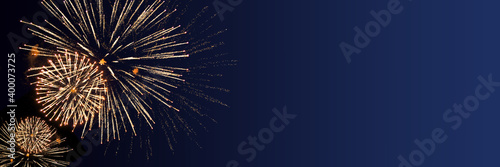 Blue Happy New Year background with golden fireworks