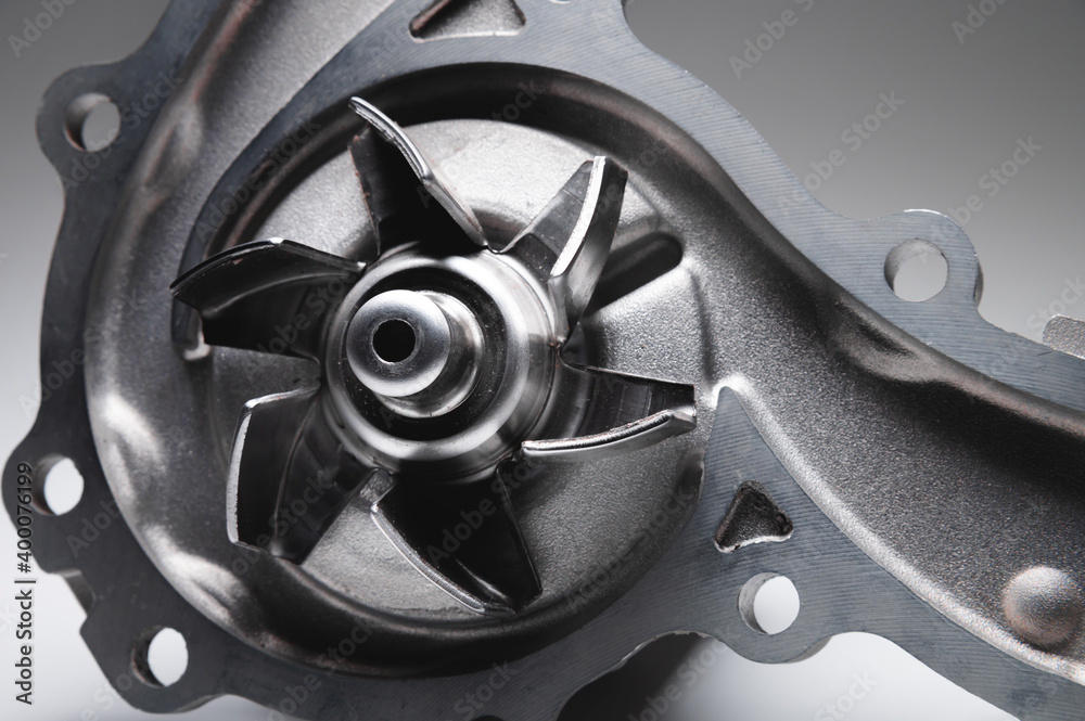 ICE liquid cooling pump. Engine coolant pump. Contrast light on gray background ICE liquid cooling pump. Engine coolant pump. Contrast light on gray background