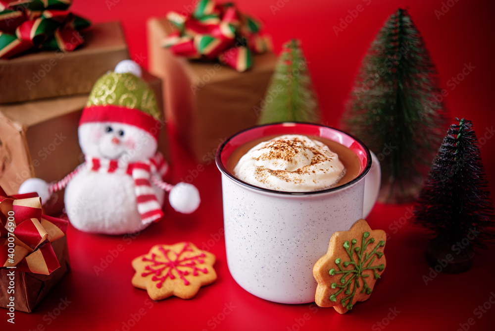 Winter Christmas holidays background with Cup of cocoa or hot chocolate with whipped cream with cinnamon sprinkles