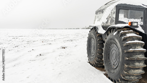 All-terrain vehicles on a winter background. Powerful off-road transporter. Engine, cross. Adventure concept.