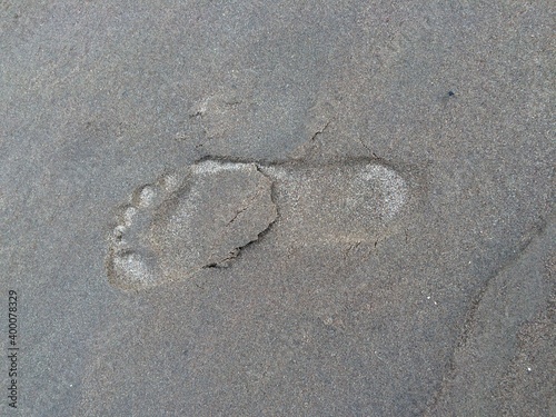 footprint in the sand on the beach