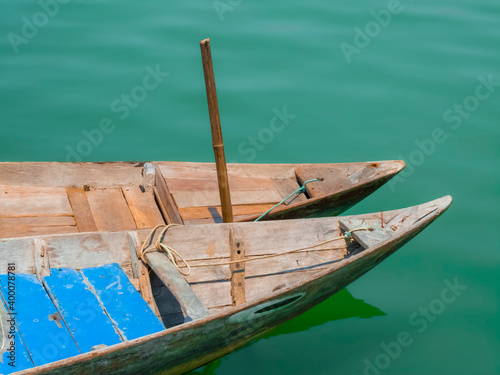 Obraz na płótnie Pair of traditional wooden Vietnamese sampan rowboats on water