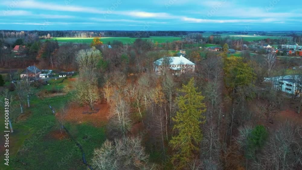 Autumn Landscape Aerial Shot Vilce Manor in Latvia. Colorful Trees, and Pine Woods in the Manor Park. 4K Video Autumn Landscape Aerial Shot Vilce Manor in Latvia. Colorful Trees, and Pine Woods in the Manor Park. 4K Video