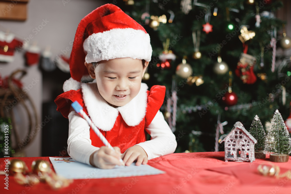 young girl was writing letter to santa at home young girl was writing letter to santa at home