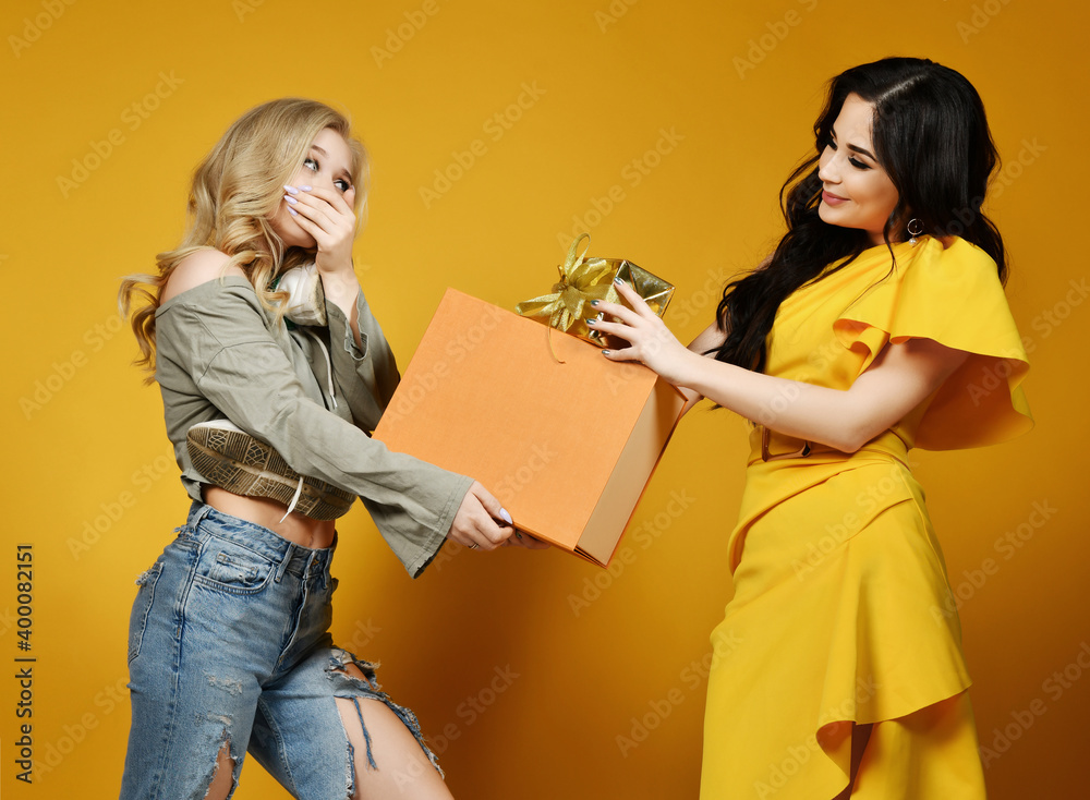 Two girls friends celebrate birthday party rich girl in yellow stylish ...