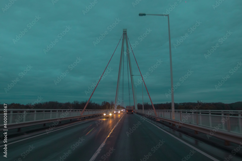 Cloudy and rainy atmosphere on a concrete suspension bridge.